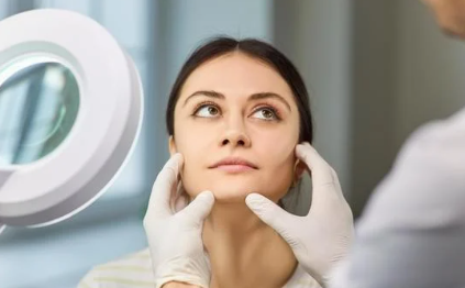 Woman's face looking at up injector before getting Radiesse at Rumi med spa in Chino California