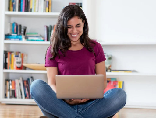 women on computer smiling and signing up for Rumi med spas newsletter in chino california